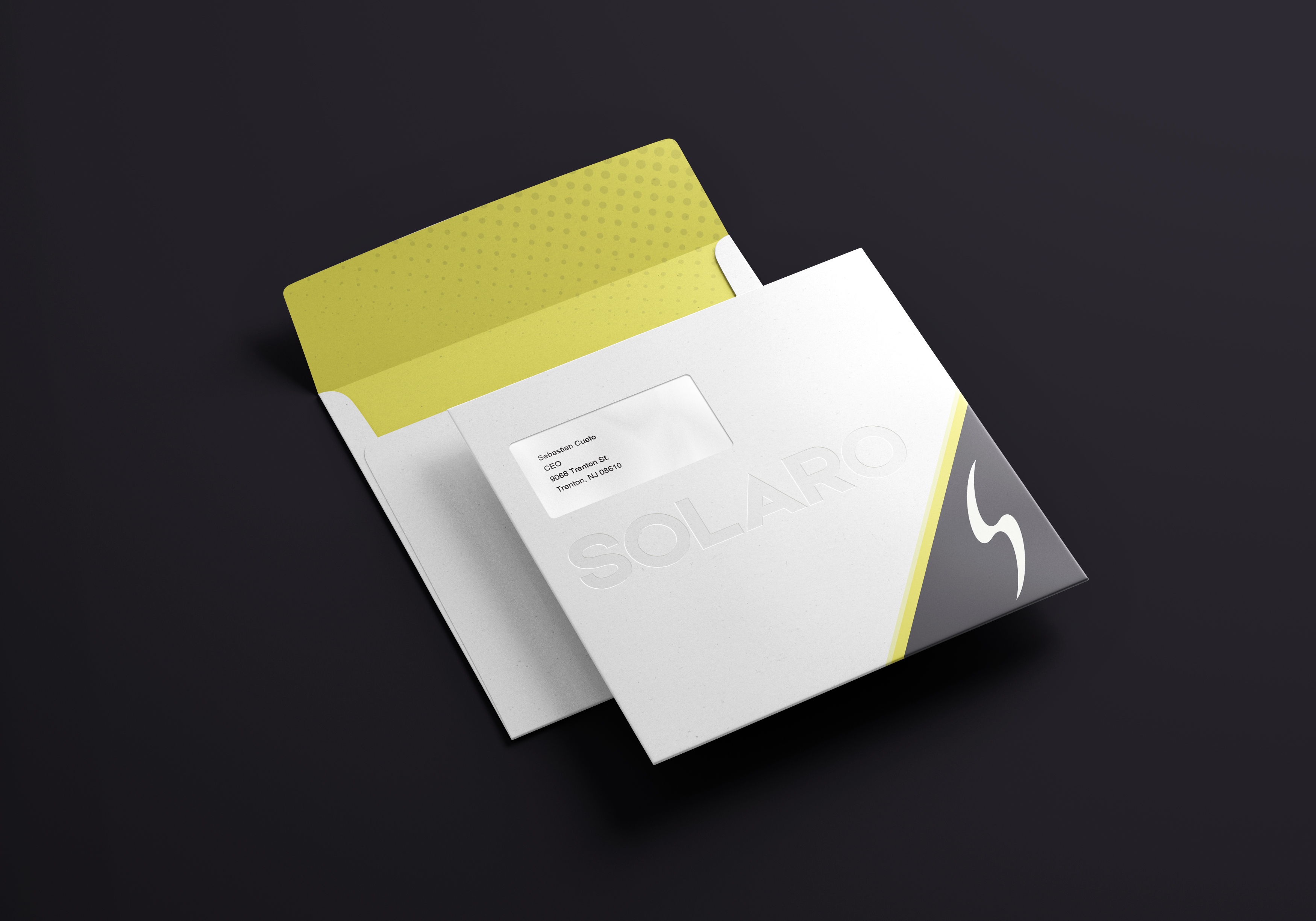 Solaro corporate stationery suite with debossed logo envelopes and solar yellow accents